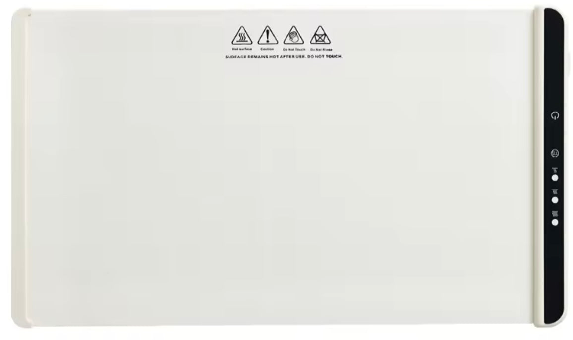 Electric food warming mat with a neutral surface and black side control panel